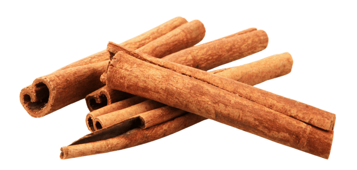 Cinnamon sticks on a black background.