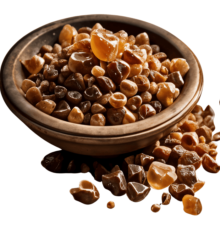 Bowl filled with amber-colored, rounded stones.