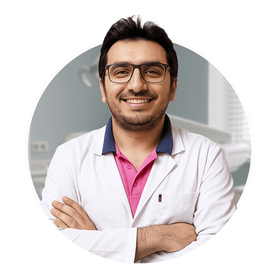 Andrew Habib, smiling dentist in lab coat